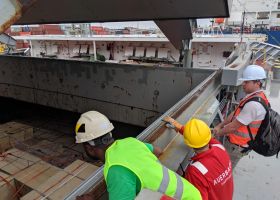 looking at cargo in vessel hatch